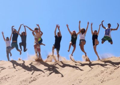 Group Jump in Tamri Dunes in Morocco