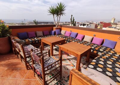 View from the terrace of Azul Guesthouse in Tamraght, Morocco, offering a panoramic view of the ocean