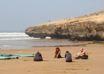 A serene, empty surf spot at sunrise in Morocco, showcasing the calm and beauty of early morning surfing conditions.
