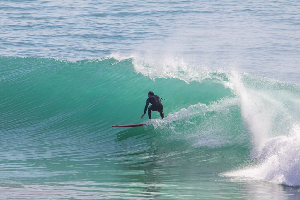 Surf Morocco October – surfer riding waves in Taghazout in October